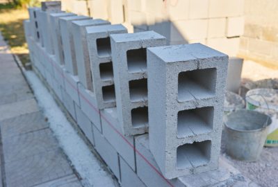 worker-builds-cinder-block-wall-new-home